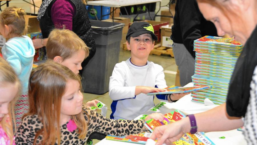 Goddard School Gives Time, Books, and Funds to Bernie’s Book Bank
