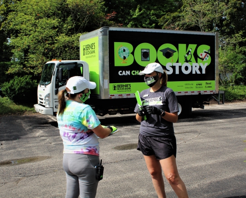 two volunteers at a Bernie's Book Bank Trier Township event