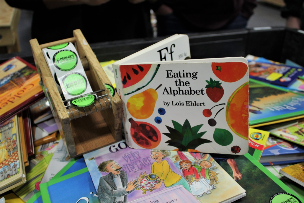 close up of donated books including Eating the Alphabet by Lois Ehlert