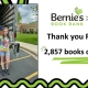 pictured: Ryleigh stands outside a truck of donated books - text: Thank you Ryleigh! 2,857 books collected