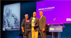Three Bernie's Book Bank representatives proudly receive the Dyer Pearl Literacy Award at the Kennedy Center