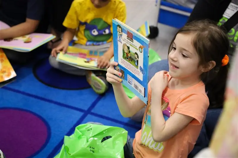 young girl reading book