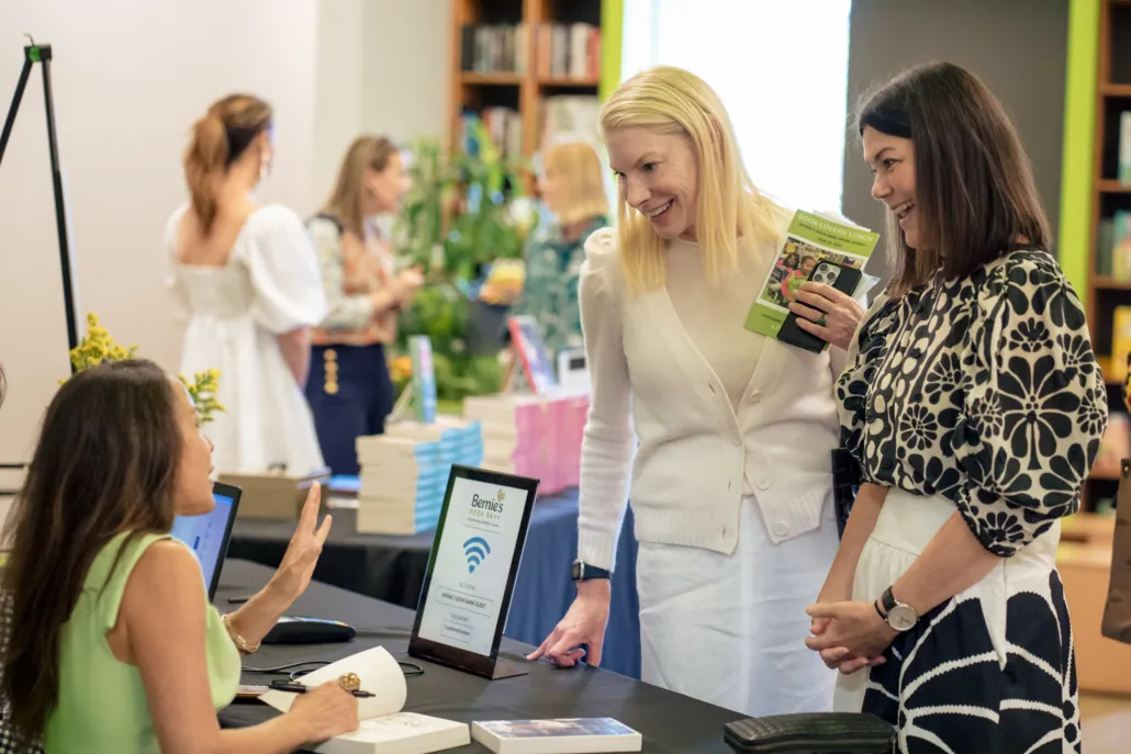 Three attendees chat at the Bernie's Book Bank Book Lovers' Lunch