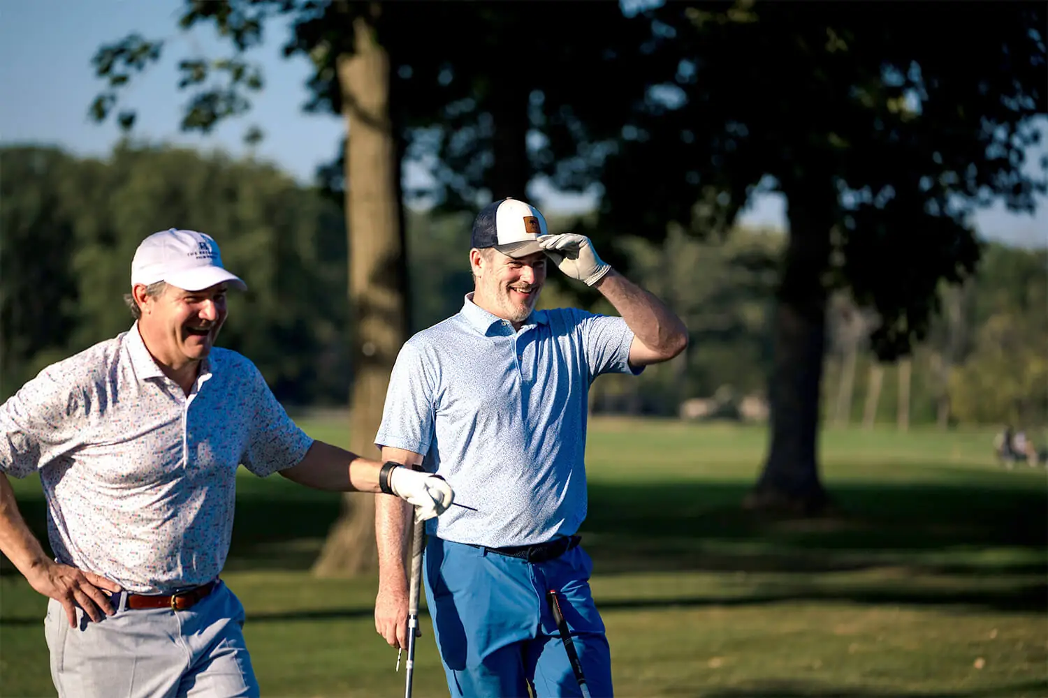 Players standing and smiling at the Bernie's Cup golf event