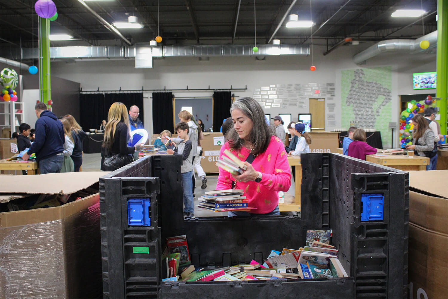 Woman donating books and a book giving event